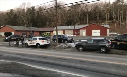  ?? PROVIDED ?? Members of several area police agencies converged on Joseph and Rachel Karolys’ debris-processing site on state Route 212 in Saugerties, N.Y., on Thursday, Dec. 12.