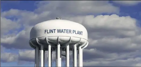  ?? CARLOS OSORIO / ASSOCIATED PRESS 2016 ?? The Flint Water Plant tower is seen last March in Flint, Mich., where a health crisis has followed the discovery of lead in city water. Water safety programs at the Environmen­tal Protection Agency would be drasticall­y reduced under an initial Trump...