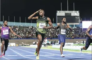  ?? REUTERS ?? Olympic champion Usain Bolt gestures after winning his final 100m sprint on Jamaican soil during the Racers Grand Prix at Kingston’s National Stadium on Saturday.