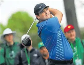  ?? AFP ?? Patrick Reed plays his shot from the ninth tee during the third round of the Masters on Saturday.