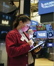  ?? COLIN ZIEMER — NEW YORK STOCK EXCHANGE VIA AP ?? Ashley Lara works on the floor of the New York Stock Exchange.