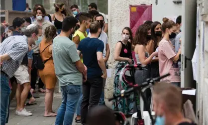  ?? Photograph: Amir Levy/Getty Images ?? People wait in line to cast their votes as Israelis head to the polls for the fourth time in two years.