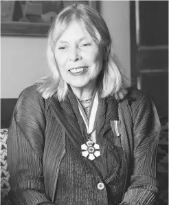  ?? JANA CHYTILOVA/ POSTMEDIA NEWS FILES ?? Joni Mitchell talks with the media in 2004 after receiving her Companions of Canada investitur­e at Ottawa’s Rideau Hall.