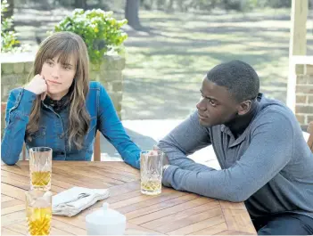  ?? JUSTIN LUBIN/UNIVERSAL PICTURES VIA ASSOCIATED PRESS ?? Allison Williams, left, and Daniel Kaluuya in a scene from Get Out.