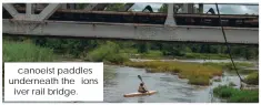  ?? ?? canoeist paddles underneath the ions iver rail bridge.