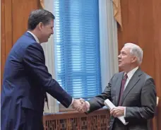  ?? POOL PHOTO BY SUSAN WALSH ?? Attorney General Jeff Sessions, left, shakes hands with FBI Director James Comey, left, at a meeting in February.