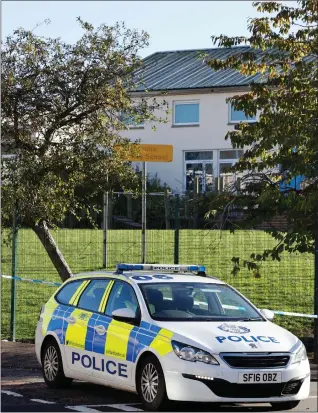  ??  ?? Police near the Morar Street scene, which was sealed off in the after the stabbing on Sunday