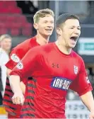  ??  ?? Back in it Conor McVey celebrates scoring to make it1-1