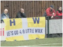  ?? ?? Hawks fans at Dorking and, right, a crowd of over 1,200 pack into seventh tier Banbury on Monday