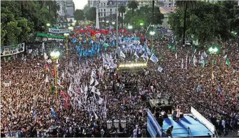  ?? AP ?? Time to go Argentina’s outgoing president Cristina Kirchner (right) speaks to supporters at Plaza de Mayo in Buenos Aires on Wednesday. Followers filled Plaza de Mayo to say goodbye on the eve of her leaving office.