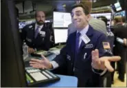  ?? RICHARD DREW — THE ASSOCIATED PRESS ?? Specialist Peter Mazza works at his post on the floor of the New York Stock Exchange on Thursday.