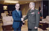  ?? (AFP) ?? Libyan strongman Khalifa Haftar (right) greets German Foreign Minister Heiko Maas in Libya’s second city of Benghazi on Thursday.