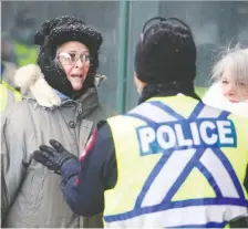  ?? BRENDAN MILLER ?? Police were ticketing protesters who are ignoring health orders and participat­ing in yet another March for Freedom at city hall on Saturday. About 200 people participat­ed in the latest event.