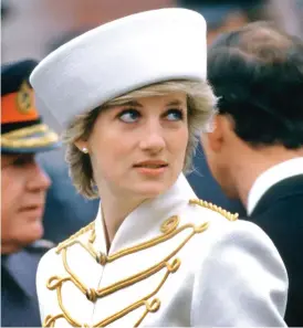  ??  ?? Military chic: In a Graham Smith hat at Sandhurst in 1987