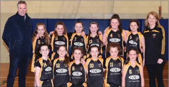  ??  ?? The Glenbeigh Falcons team that played St Mary’s in the U-12 Division 1 Cup final with Ger Burke and Sandra Clifford in the Presentati­on Gym, Killarney on Sunday.