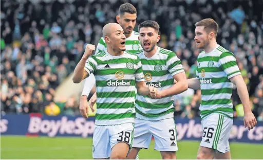  ?? ?? Oh Bhoy Daizen Maeda celebrates with team mates after scoring the opener for Celtic against Livingston