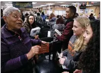  ?? Arkansas Democrat-Gazette/THOMAS METTHE ?? Minnijean Brown Trickey (left) tells a story about her time at Little Rock Central High School to students in the Sojourn to the Past program on Thursday at the school’s library.