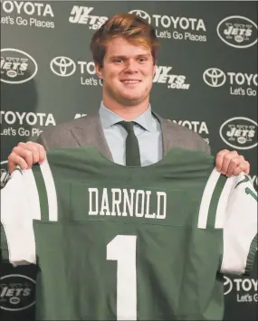  ?? Julie Jacobson / Associated Press ?? Sam Darnold poses for photos on Friday before a news conference introducin­g him as the New York Jets’ selection from the first round in the NFL Draft.
