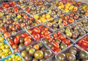  ?? J. Scott Applewhite Associated Press ?? SCIENTISTS HAVE found the chemical compounds responsibl­e for that sweet, earthy, slightly grassy taste of tomatoes — something often lacking in grocery store fruit, which is bred for resiliency, among other traits.