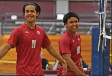  ?? CHRIS CHRISTO / HERALD STAFF ?? BACK ON THE COURT: Lowell’s Alex Chau, left, and Tevin Lout react to a point in a win over Andover on Wednesday.