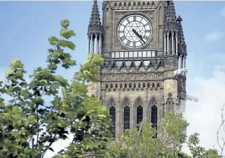  ?? POSTMEDIA NETWORK FILES ?? The Peace Tower is seen in Ottawa on July 8. The federal government started the fiscal year with the tiniest of budgetary surpluses, though the black ink is expected to turn very red in the coming months. Ottawa’s fiscal year runs from April 1 to March...