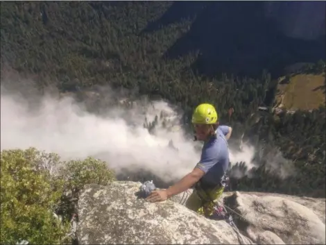  ?? PETER ZABROK VIA AP ?? Climber Ryan Sheridan, who had just reached the top of El Capitan, a 7,569-foot formation, when a rock slide let loose below him Thursday in Yosemite National Park is shown. It was not immediatel­y clear if there were new casualties, a day after another...