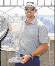  ?? MIKE STOBE / GETTY IMAGES ?? Last year’s Barclays winner, Hunter Mahan (above, with the trophy), is ranked No. 71 but needs a solid season finish to keep his playoff streak alive.