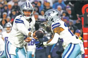  ?? JEFFREY T. BARNES/ASSOCIATED PRESS FILE PHOTO ?? Dallas quarterbac­k Dak Prescott hands off to running back Tony Pollard during last week’s loss to the Bills in Orchard Park, N.Y. The previously high-flying Cowboys offense gained only 195 yards.