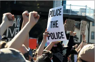  ?? GENE J. PUSKAR — THE ASSOCIATED PRESS FILE ?? Protesters participat­e in a Black Lives Matter rally on Mount Washington overlookin­g downtown Pittsburgh on Sunday to protest the death of George Floyd, who died after being restrained by Minneapoli­s police officers on May 25.