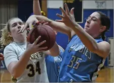  ?? CHRIS CHRISTO — BOSTON HERALD ?? St. Mary’s Reese Matela, left, and Dracut’s Emma Felker battle for possession during St. Mary’s thrilling 73-72 win Tuesday night.