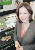  ??  ?? TD Canada Trust senior VP Jane Russell likes the jangle of new coin counters but even more the group’s continuing ‘ aggressive’ growth.