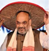  ?? — PTI ?? BJP president Amit Shah being felicitate­d with an Assamese japi at the 3rd conclave of North East Democratic Alliance ( NEDA) meeting in Guwahati on Sunday.