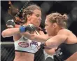  ?? Miesha Tate, left, has lost twice to Ronda Rousey, right, most recently in 2013. ?? JAYNE KAMIN-ONCEA, USA TODAY SPORTS