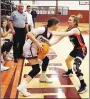  ?? Westside Eagle Observer/RANDY MOLL ?? Alyssa McCarty protects the ball while guarded by a player from Rogers-Heritage on Nov. 15 at Gentry High School.