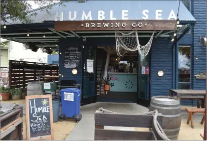  ?? PHOTOS BY JAY R. BROOKS ?? Humble Sea Brewing in Santa Cruz has decor that mimics a ship's interior and offers about 20 different beers.