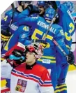  ?? JULIO CORTEZ/AP PHOTO ?? SWEDE WIN Swedish players celebrate a goal behind Czech Republic goaltender Jakub Kovar during their 4-2 win.