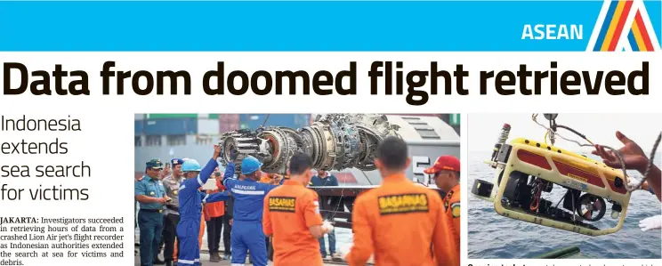  ?? — AFP — AFP ?? Handle with care: Indonesian rescue personnel unloading part of an engine recovered from the wreckage at a port in Jakarta. Ongoing task: A remotely operated underwater vehicle being prepared to search for the cockpit voice recorder in the waters off Karawang, north of Jakarta.