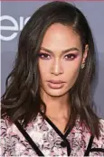  ??  ?? Joan Smalls does pink-onpink to beautiful effect.
