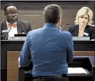  ?? Arkansas Democrat-Gazette/MITCHELL PE MASILUN ?? State Department of Education officials Jeremy Owoh and Ivy Pfeffer listen Wednesday to Dan Fushee of Focus Academy of Arts and Sciences in Bentonvill­e during a Charter Authorizin­g Panel meeting in Little Rock.