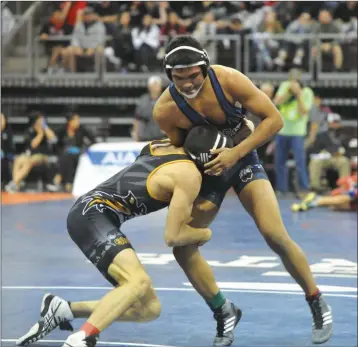  ??  ?? SAN PASQUAL’S NICHOLAS STEELE (right) braces the impact from Arizona Lutheran’s Jake Borneman during the 145-pound championsh­ip. Steele won with a 10-2 major decision.