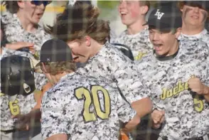  ?? ?? Lookout Valley players celebrate Jacob Winchester’s home run.