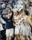  ?? JESSICA HILL — THE ASSOCIATED PRESS ?? Connecticu­t’s Tierney Lawlor, left, celebrates with Gabby Williams, center, and Kia Nurse, right, during the second half against South Florida in the American Athletic Conference tournament finals at Mohegan Sun Arena, Monday in Uncasville, Conn.