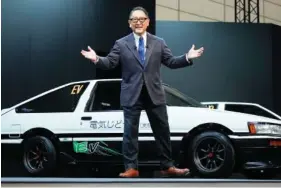  ?? AP PHOTO/EUGENE HOSHIKO ?? Toyota Motor Corp. Chief Executive Akio Toyoda delivers a speech Friday on the stage at the Tokyo Auto Salon, an industry event similar to the world’s auto shows, in Chiba near Tokyo.