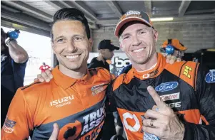  ?? PHOTO: GETTY IAMGES ?? No 1 . . . Lee Holdsworth (right) and codriver Michael Caruso celebrate provisiona­l pole after practice at Bathurst yesterday.