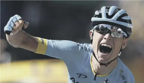  ??  ?? 0 Magnus Cort Neilsen roars his joy as he crosses the line in Carcasonne at the conclusion of Stage 15 of the Tour de France.