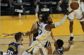  ?? JEFF CHIU — THE ASSOCIATED PRESS ?? Warriors forward Marquese Chriss shoots against the Nuggets during the second half on Saturday in San Francisco.