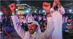  ?? | Reuters ?? People react as they watch screens displaying informatio­n of the Hope Probe entering the orbit of Mars, in Dubai, United Arab Emirates, yesterday.
