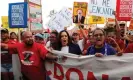  ??  ?? Senator Kamala Harris, center, joins striking McDonald’s workers in Las Vegas demanding an increase in the minimum wage. Photograph: Mike Segar/Reuters