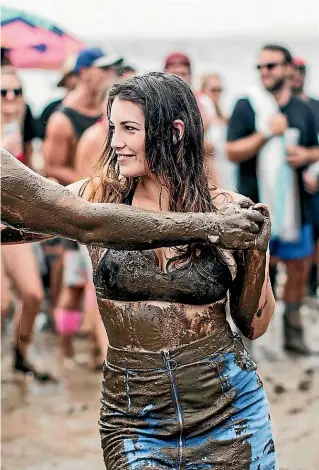  ?? LAWRENCE SMITH/ STUFF ?? Splore at Ta¯papakanga Regional Park is often turned into a mudbath but it doesn’t dampen the spirits of the festival-goers.