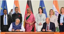  ?? AFP ?? Indian Prime Minister Narendra Modi and German Chancellor Olaf Scholz sign an agreement yesterday